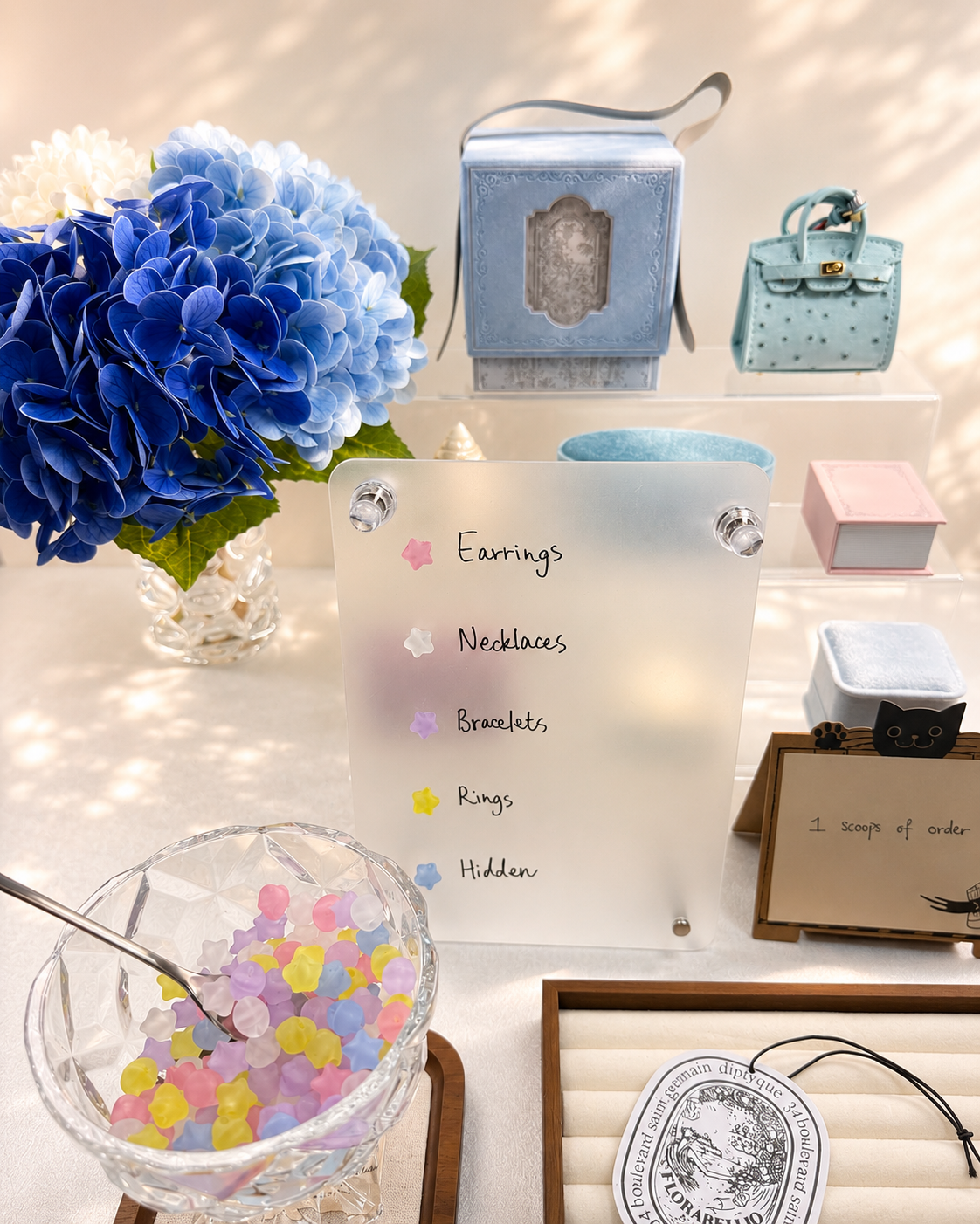 Lucky Scoop jewelry display with earrings, necklaces, bracelets, rings, and gift boxes